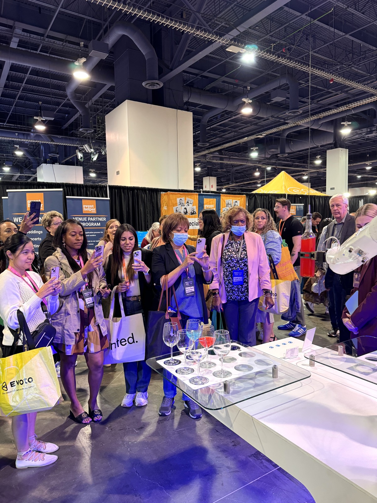 Crowd filming the RoboBar robotic bartender at a trade show