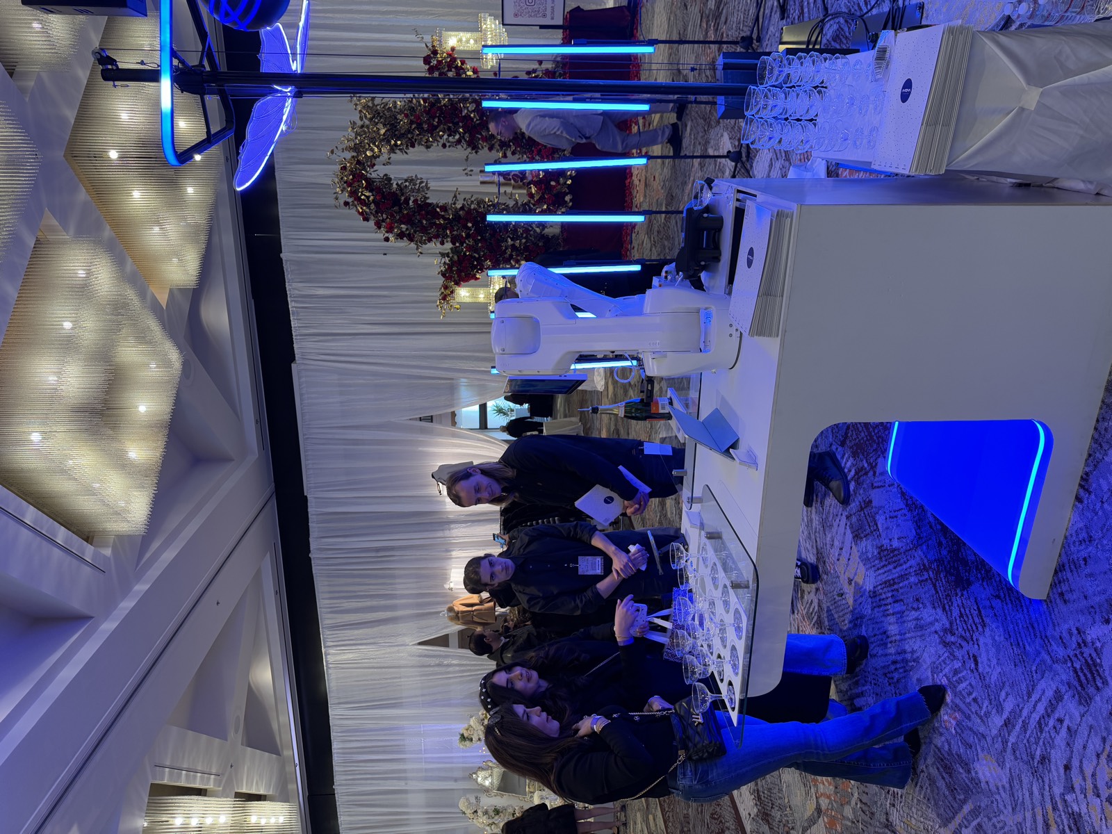 RoboBar robotic bartender pouring champagne at a luxury wedding showcase